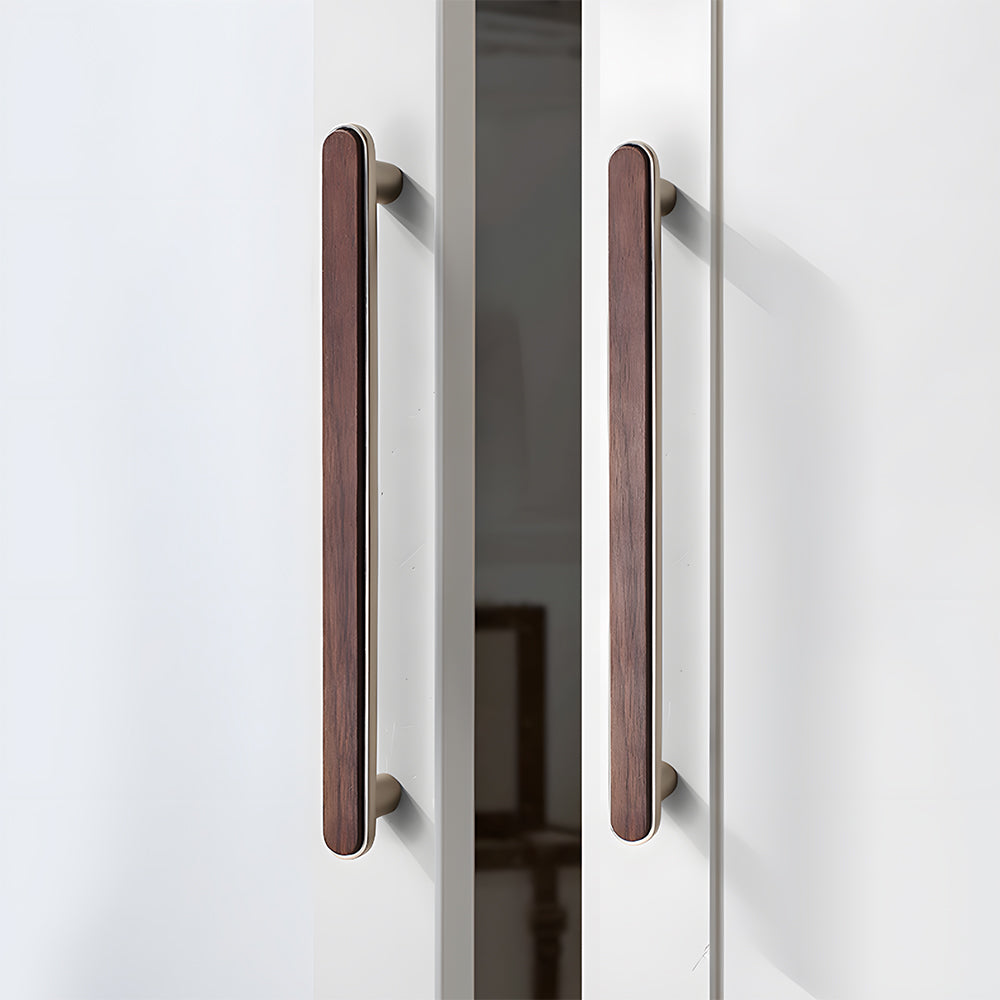 Walnut inlay cabinet pull in silver with 192 mm centers, shown on cabinet fronts in a bright room setting