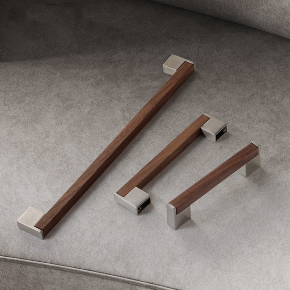Walnut T-bar cabinet pull in black walnut with 160 mm centers, shown in a styled group with multiple available versions