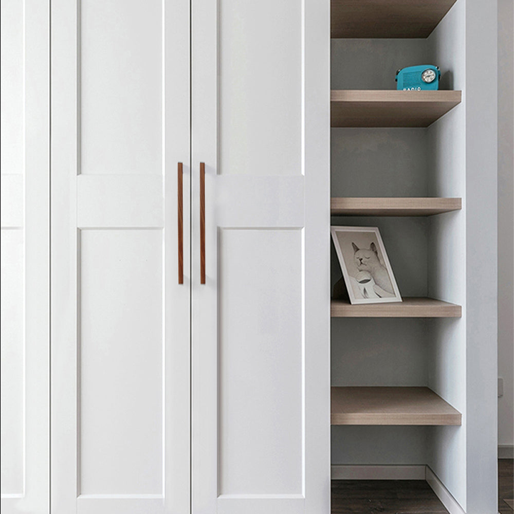 Black walnut wood T-bar cabinet pull with silver-toned ends, installed vertically on paired wardrobe doors