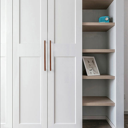 Black walnut wood T-bar cabinet pull with silver-toned ends, installed vertically on paired wardrobe doors