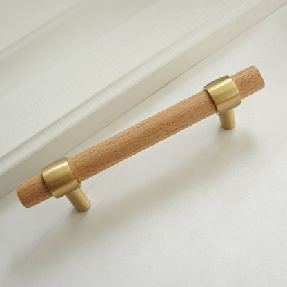 Wood cabinet pull with brass bases in beech, shown as a single product on a white background