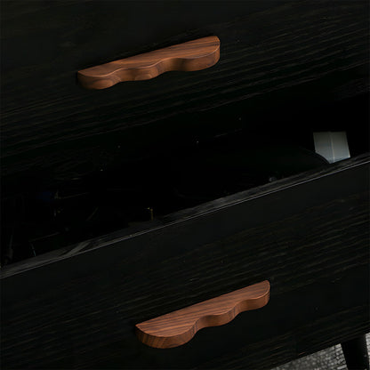 Wavy wood cabinet pull with a sculpted three-curve profile, shown in use on a pulled-open drawer