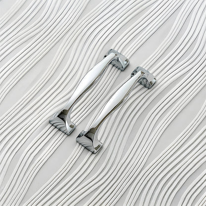 Wide arched brass cabinet pull with flared square ends, shown in a focused view as a color and finish lineup