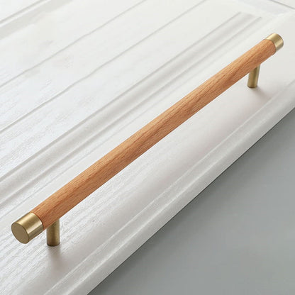 Wood cabinet handle with brass end caps, shown in a close angled view with its profile visible