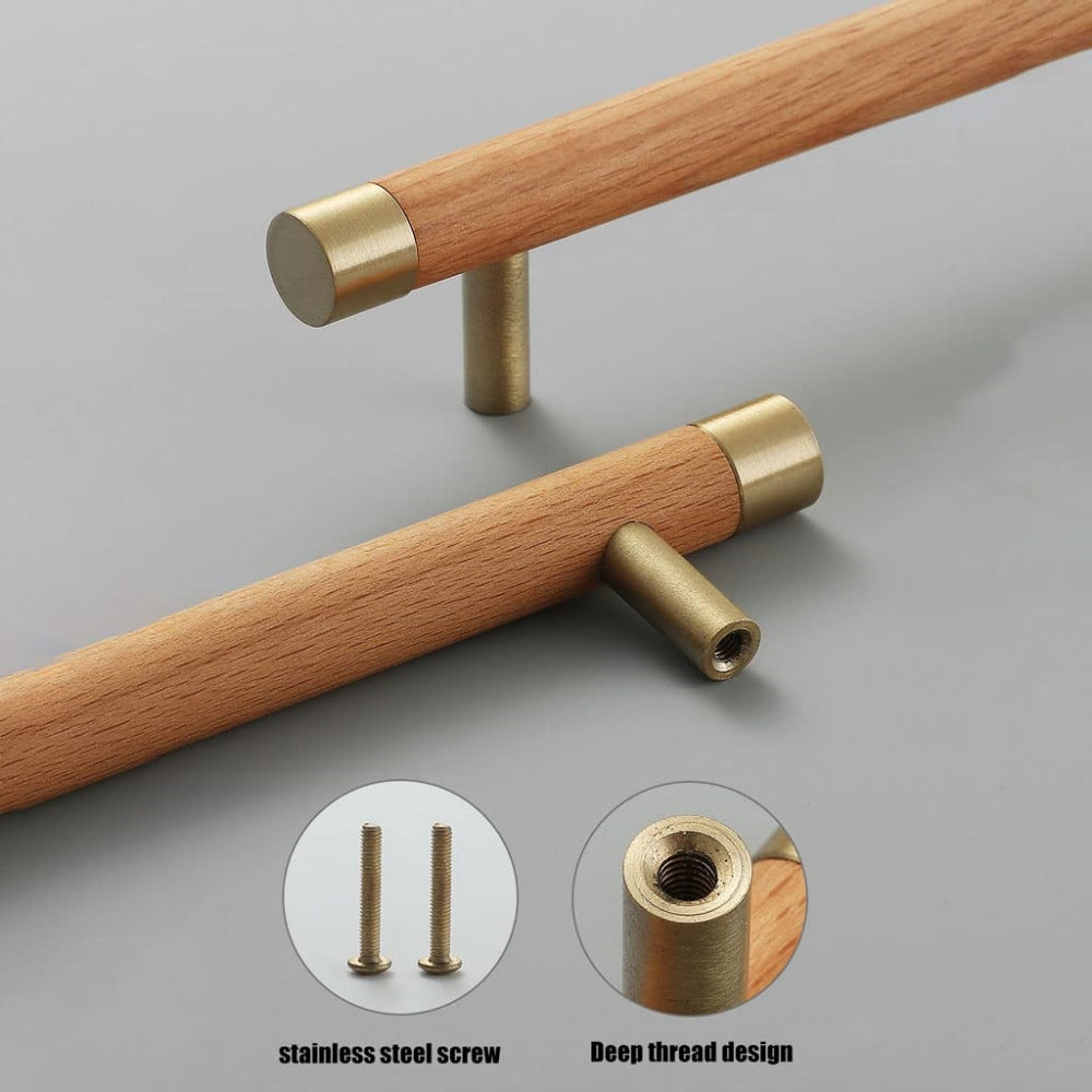 Light wood cabinet handle with brushed brass end caps, shown with its back construction and mounting points visible