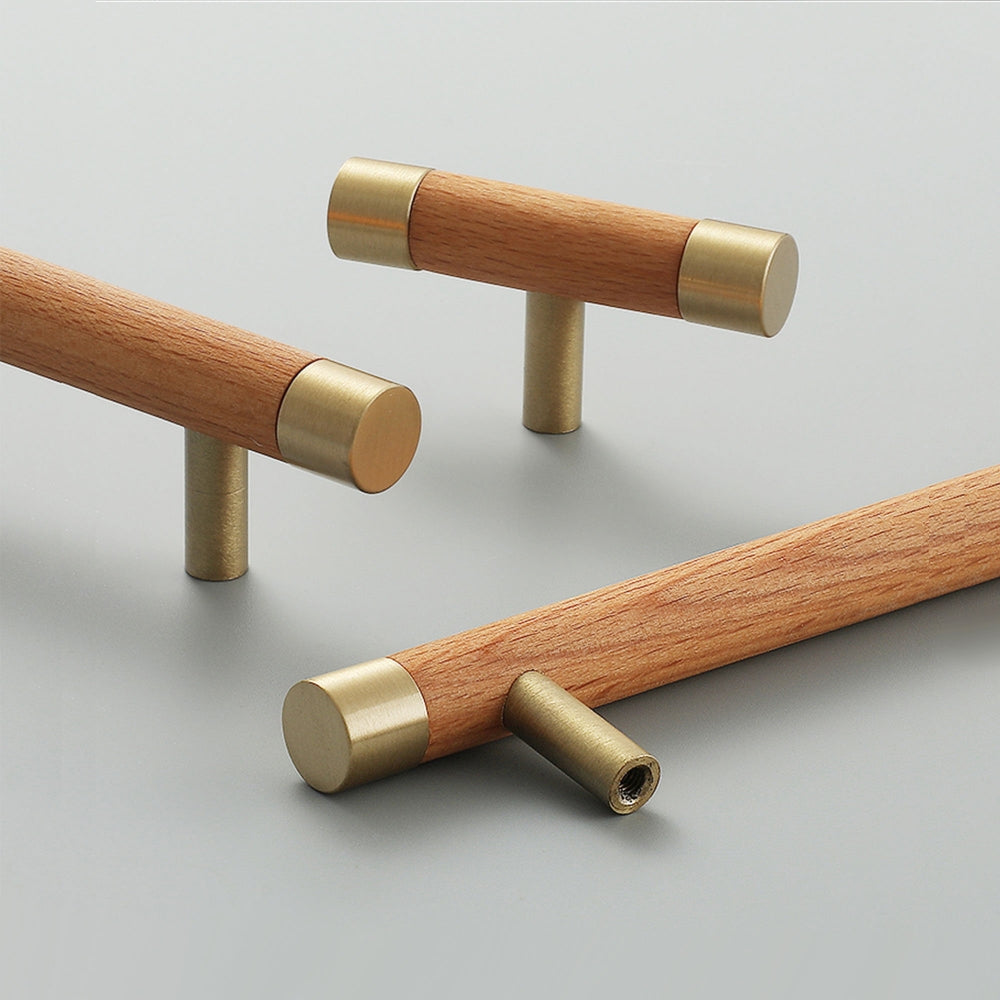 Light wood cabinet handle with brushed brass end caps, shown in a styled group with multiple available versions