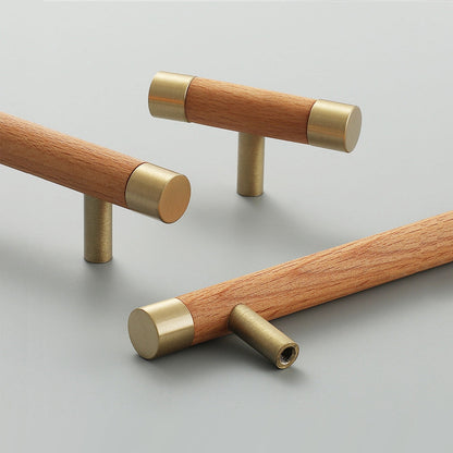 Light wood cabinet handle with brushed brass end caps, shown in a styled group with multiple available versions
