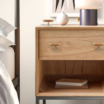 Light wood cabinet handle with brushed brass end caps, installed horizontally on a drawer front in a close view