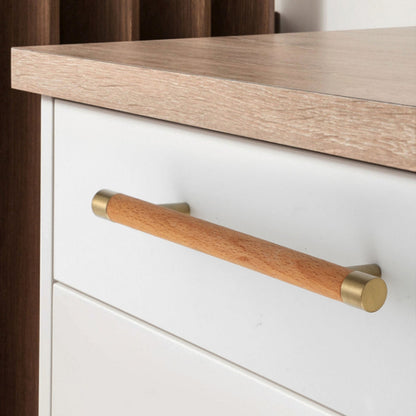 Light wood cabinet handle with brushed brass end caps, shown across several drawer fronts in a cabinet scene