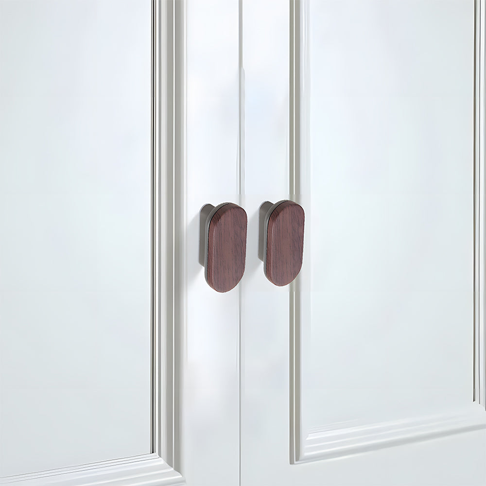 Wood-grain cabinet pull, mounted as matching hardware on double cabinet doors, with the finish clearly visible
