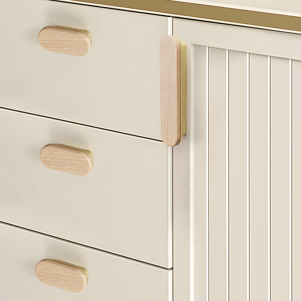 Wood-grain cabinet pull in light wood with a gold base with 32 mm centers, installed horizontally on a drawer front