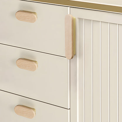 Wood-grain cabinet pull in light wood with a gold base with 32 mm centers, installed horizontally on a drawer front