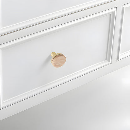 Wood-grain cabinet pull, installed on light cabinet doors with the profile visible