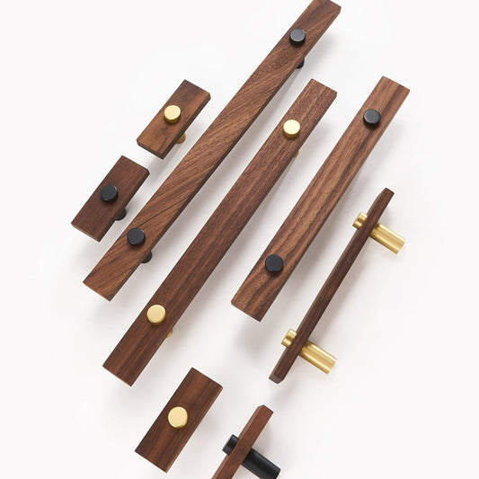 Wood-grain cabinet pull with metal posts, arranged together for a size and style comparison