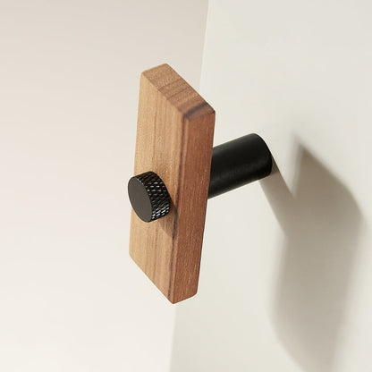 Wood-grain cabinet knob with a round metal post, shown alone on a light background