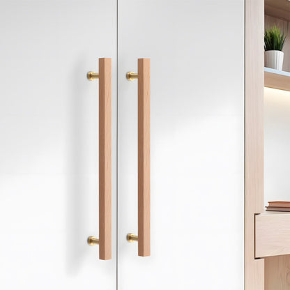Square wood cabinet pull in white with 192 mm centers, installed on paired cabinet doors in a close view