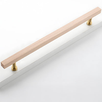 Square wood cabinet pull with round brass bases, shown horizontally on a simple light surface