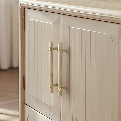 Wood round bar cabinet pull in white with 128 mm centers, installed on paired cabinet doors in a close view