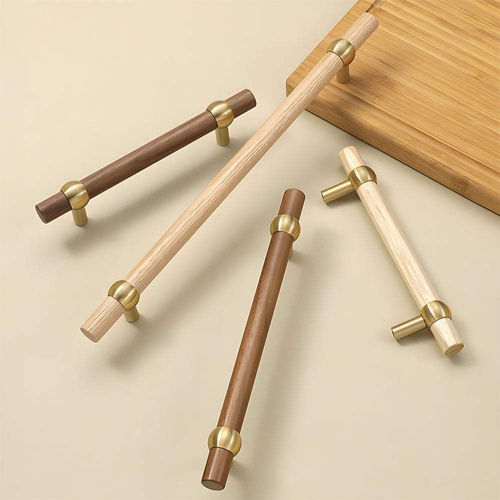 Wood and brass round bar cabinet pull with collar details, grouped on a light surface to compare lengths and profiles
