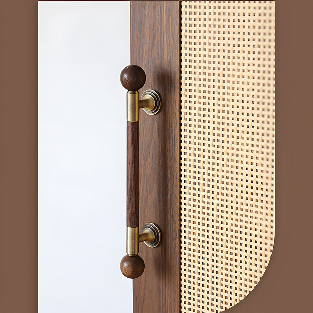 Round wood cabinet pull in gold with 128 mm centers, mounted as matching hardware on double cabinet doors