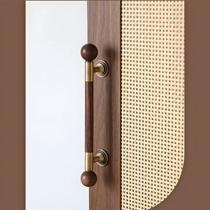 Round wood cabinet pull in gold with 128 mm centers, mounted as matching hardware on double cabinet doors