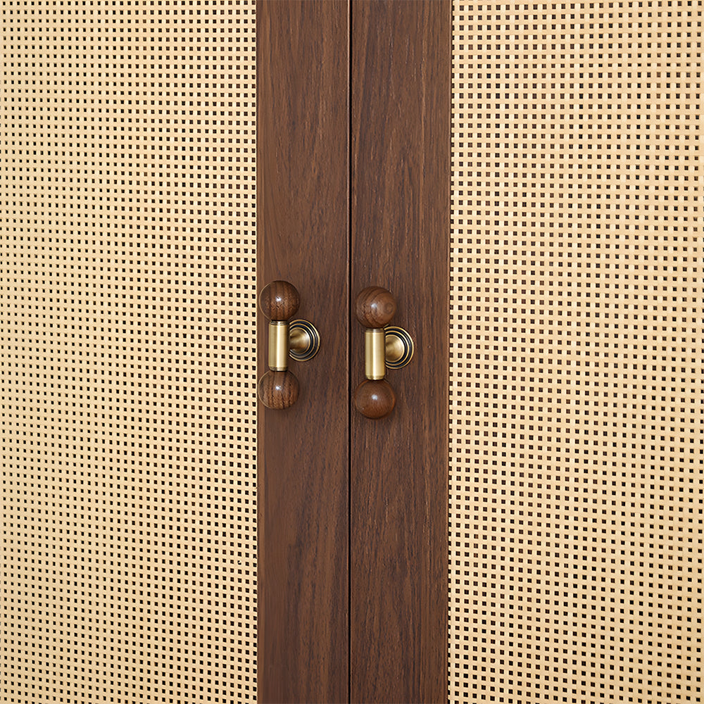 Round wood cabinet pull as a gold single-hole version, shown in a close installed view across cabinet fronts