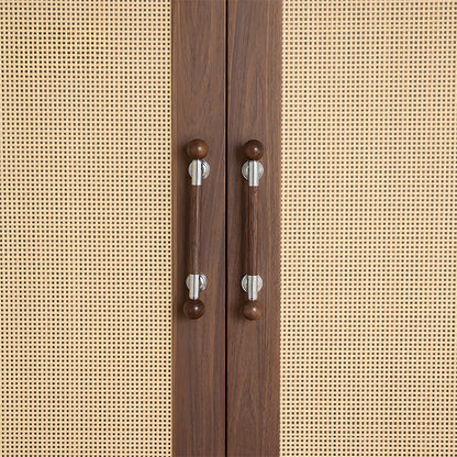 Round wood bar cabinet pull with brass mounts, installed on cabinet doors with a hand reaching toward it