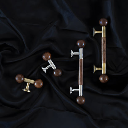 Round wood bar cabinet pull with brass mounts, grouped on a light surface to compare lengths and profiles