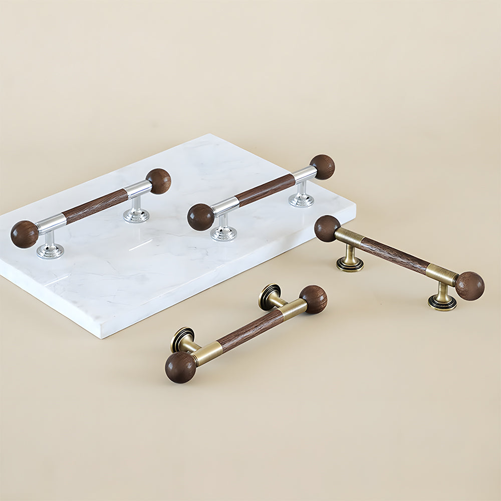 Round wood bar cabinet pull with brass mounts, grouped in long and short versions on a neutral surface
