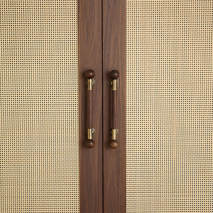 Round wood bar cabinet pull with brass mounts, installed on paired cabinet doors in a close view