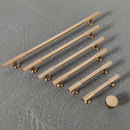 Matte gold fluted bar cabinet pull and round knob, presented in another view as a color and finish lineup