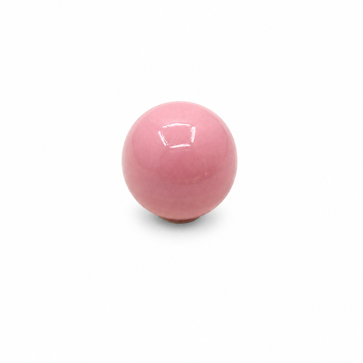 Pink ceramic ball cabinet knob on a white background